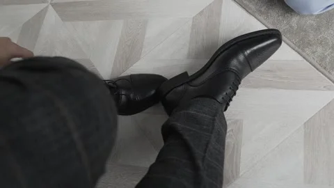 Man putting on shoes, close-up Stock Footage 306148246