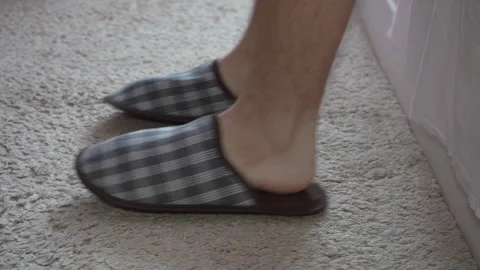 Man putting on slippers close-up Video stock 303901980