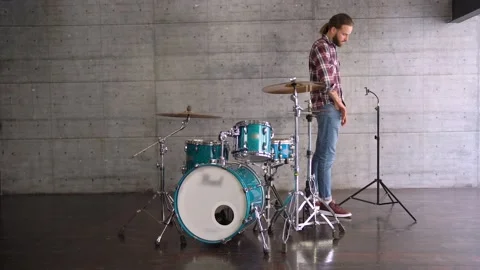 Man Putting Smartphone on a Tripod to Make Online Video of Playing Drums Stock Footage 155554678