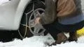 Man putting snow chains HD Footage