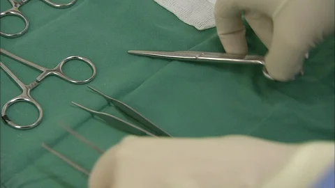 Man putting surgical tools on table Video stock 95604135