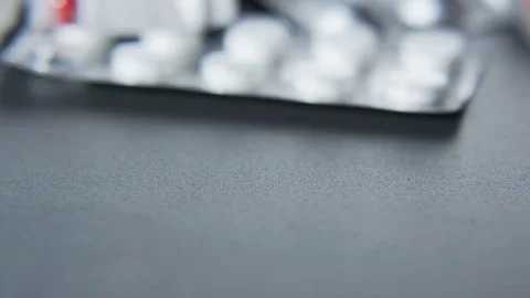 Man Putting Tablets on a Table Stock Footage 69215366