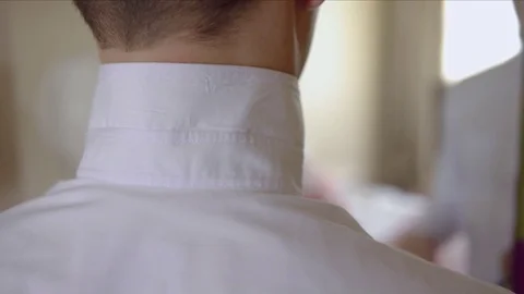 Man putting on tie-butterfly Video stock 70298325