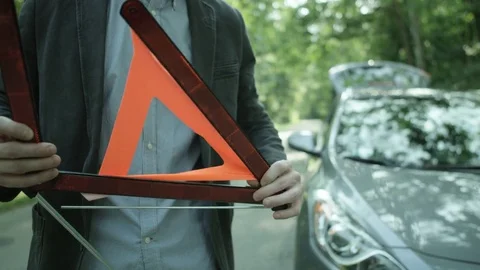 Man Putting Together the Warning Triangle and Leaving Stock Footage