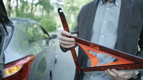 Man Putting Together the Warning Triangle and Leaving Stock Footage