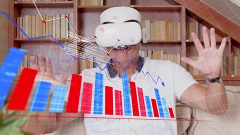 Man putting on VR headset and interacting on beige sofa, analyzing tech charts Stock Footage 333838037