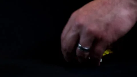 Man Putting White Pills Back in Pill Bottle on Black Background Video stock 249355943