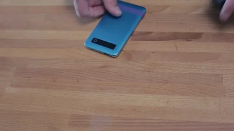 Man putting wireless devices on table. Video stock 90526576