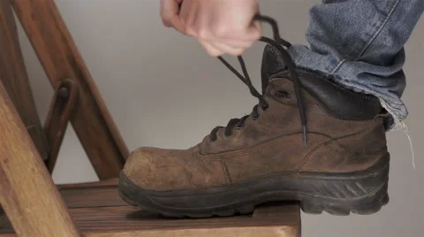 Man Putting On Workboot Video stock 46059886