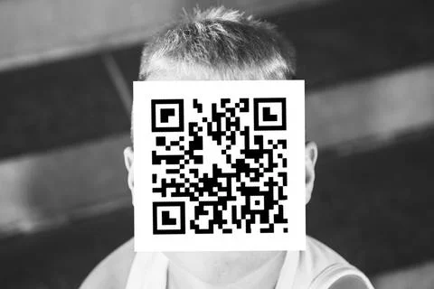Man with qr code on his face Stockfoto's