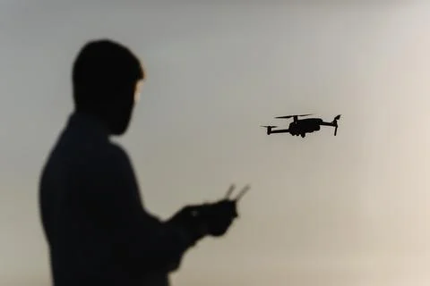 Man with quadcopter at field Stock Photos