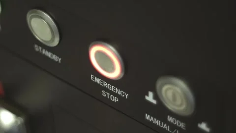 The man quickly presses the emergency stop button on the monitor  Stock Footage 287944753