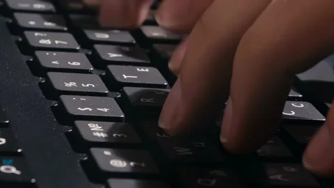 The man quickly presses the keys. fast typing. work with computer.  Stock Footage 149312285