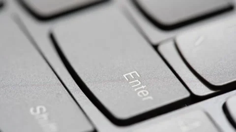 Man quickly pressing the enter key on a modern laptop computer keyboard, ma.. Stock-Footage 307614224