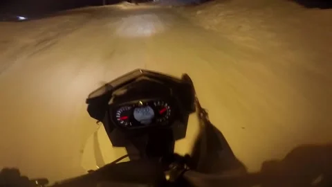 Man quickly rides a snowmobile and starts to stop Video stock 102163706
