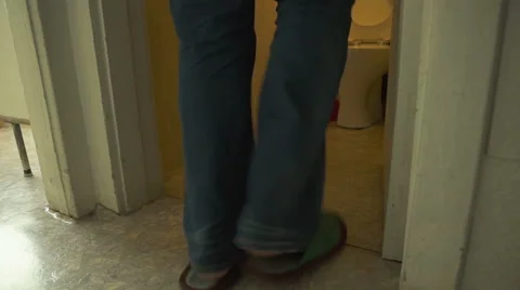 The man quickly runs to the toilet Stock Footage 47787902