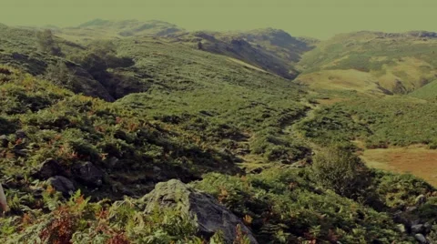 Man quickly walks mountain pathway away from camera Stock Footage 41946184