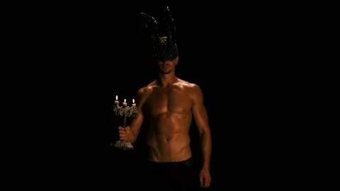 Man in a rabbit mask blows out a candle Video stock 94037620