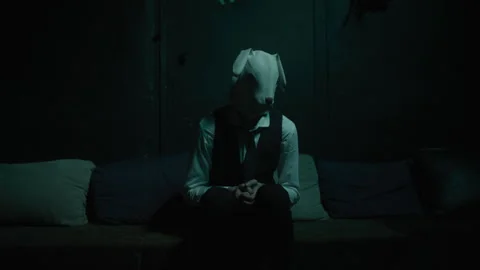 A man with rabbit mask sitting on the couch Video stock 259021052