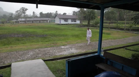 Man in Rain, Indonesia Stock Footage 32284062