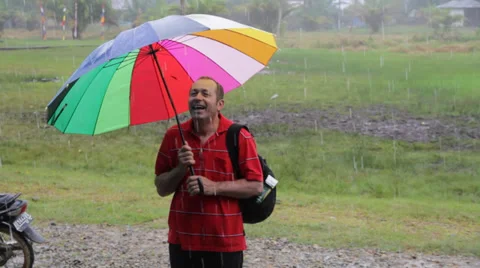 Man in Rain, Indonesia Stock Footage 32284187