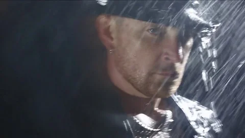 Man in rain, slow motion. FULL HD Video stock 84206748