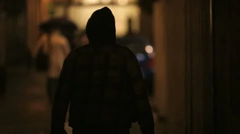 Man rainy alley 1 Stock Footage
