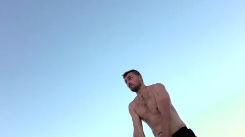 Man to raise two dumbbells at the same time. Slow motion Video stock 68563918