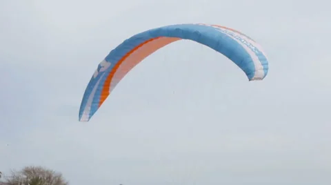 A man raises a glider into the air on the square Stock Footage 62801600