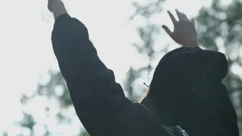 The man raises his hands in the sky. Stock Footage 81647764