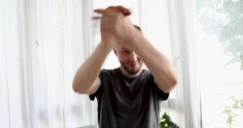Man raises his hands in support Stock Footage 204960603