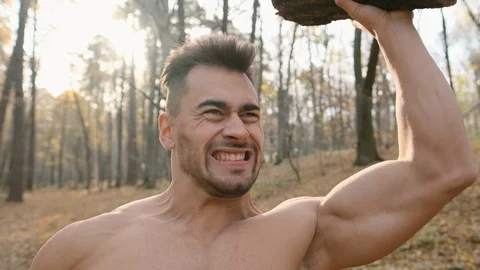 Man Raises Large Heavy Tree Trunk. Stock Footage 120650858
