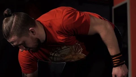 A man raises a weight Stock Footage 71951040