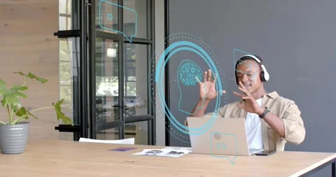 Man raising hands, activating blue brain and chat UI above laptop, manipulating Stock Footage 320956293