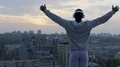 Man raising hands to sky at sunset absorbing its strength and energy, meditation HD Footage