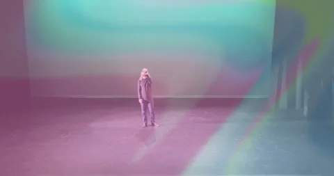 Man raising smartphone for recording in technology initiating pastel patterns 스톡 동영상 327126595