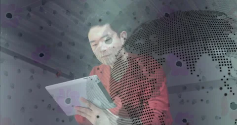 Man raising tablet and analyzing data with animated code and world map graphics 库存影片 313493660