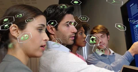 Man raising tablet pointing at sustainability dashboard colleagues analyzing Stock Footage 320068640