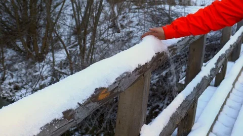 A man rakes the snow  Stock Footage 88921526