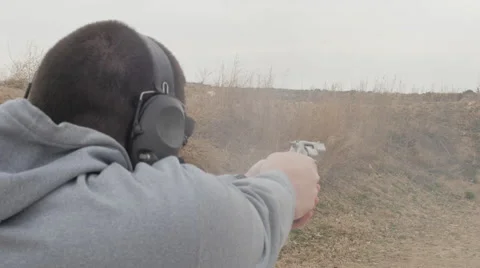Man Rapidly Fires a Revolver Stock Footage 60705200
