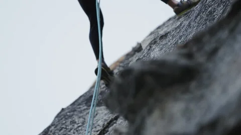 Man Rappelling In Slow Motion Down A Rock Wall Stock Footage 64309303