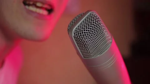 A man rapping in the studio and recording his track Stock Footage 148042945