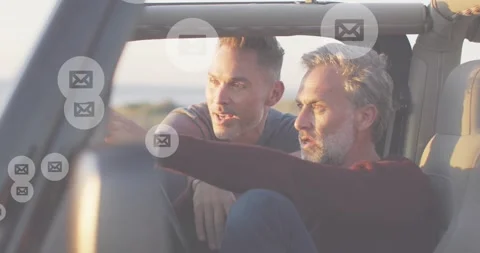 Man reaching dash, adjusting while driver watching, checking car messages, mail Stock Footage 330443939