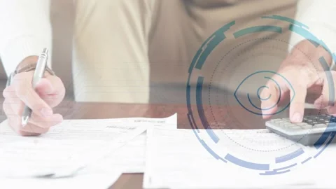 Man reaching for pen by documents, pressing calculator keys, reviewing finances Stockbeeldmateriaal 318545051