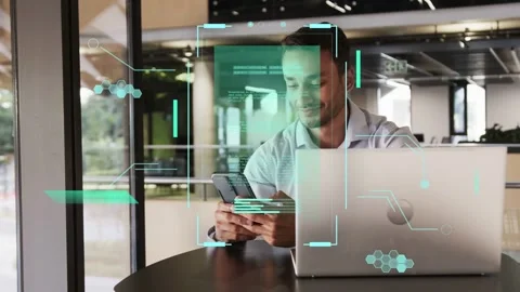 Man reaching for phone in tech office, teal AR UI appearing, scrolling, Stock Footage 334788510