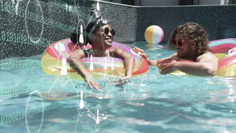 Man reaching to tap woman's ring woman laughing paddling floating with binary Stock Footage 333671224