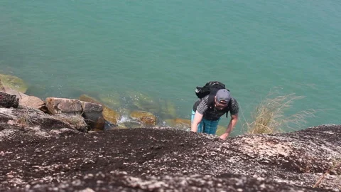 Man Reaching The Top Doing His Best Stock Footage 102032169