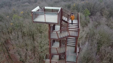 A man reaching the top of a lookout Stock Footage 121802404