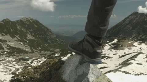 Man reaching the top of the mountain. Blackmagic 4k camera Video stock 64351087