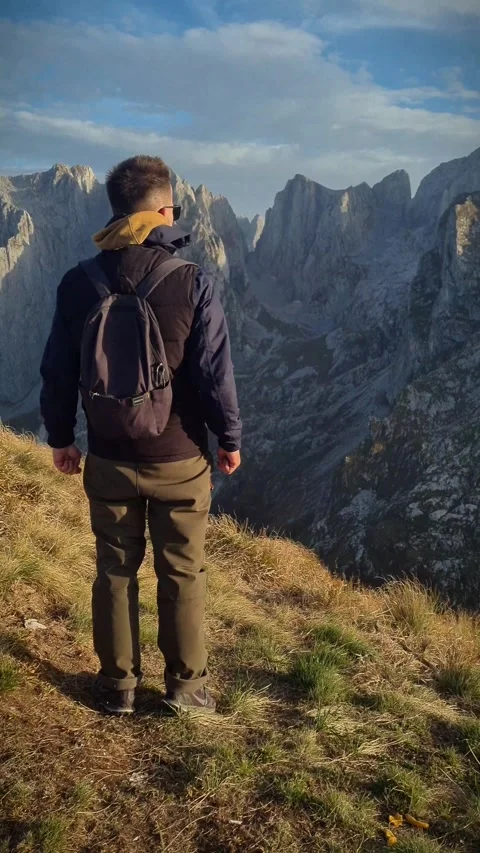 Man reaching the top of the mountains Stock Footage 256036081